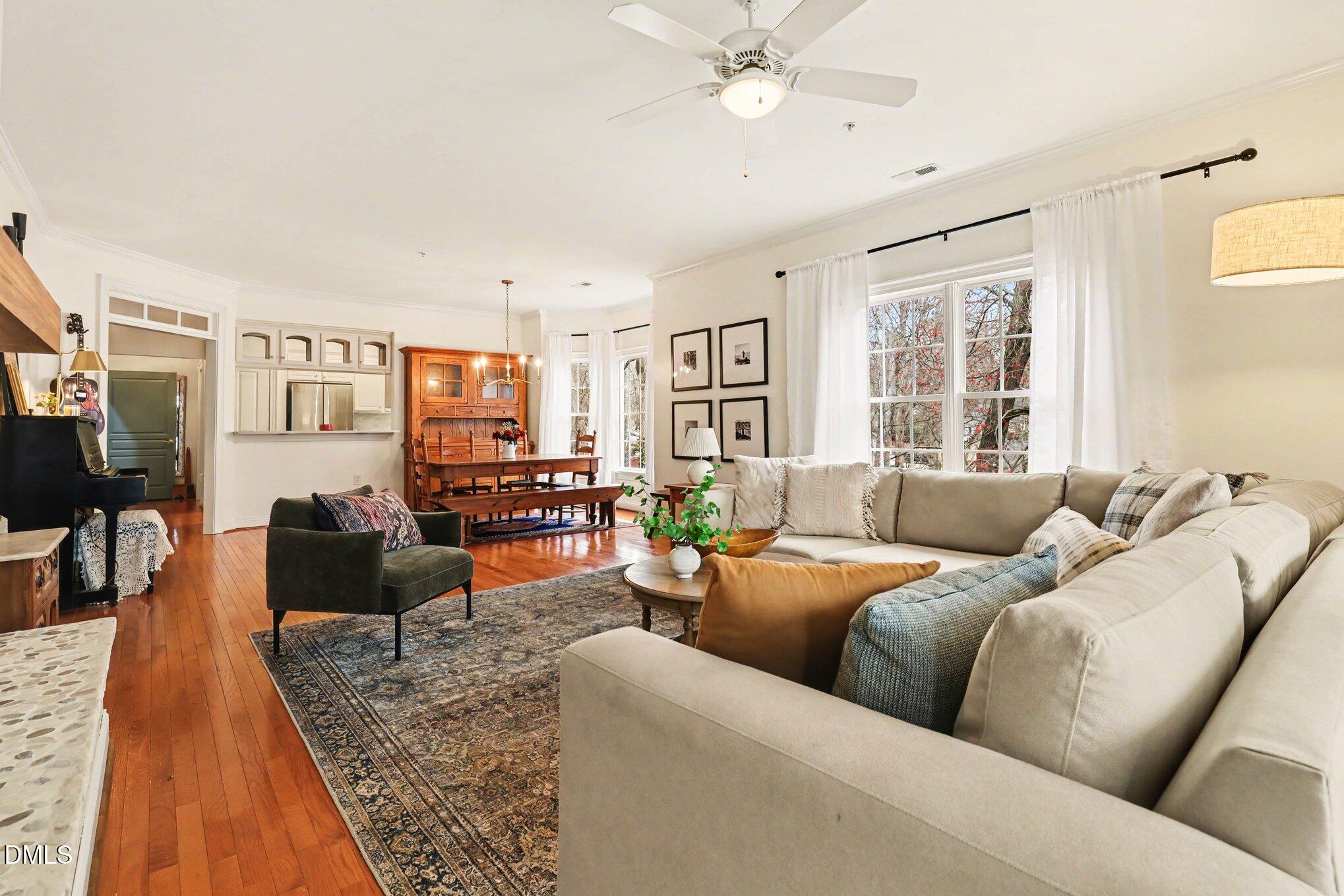 7530 Lead Mine Road, Unit 202 Raleigh, NC 27615 - Photo 3 of 36 a living room with furniture and a large window