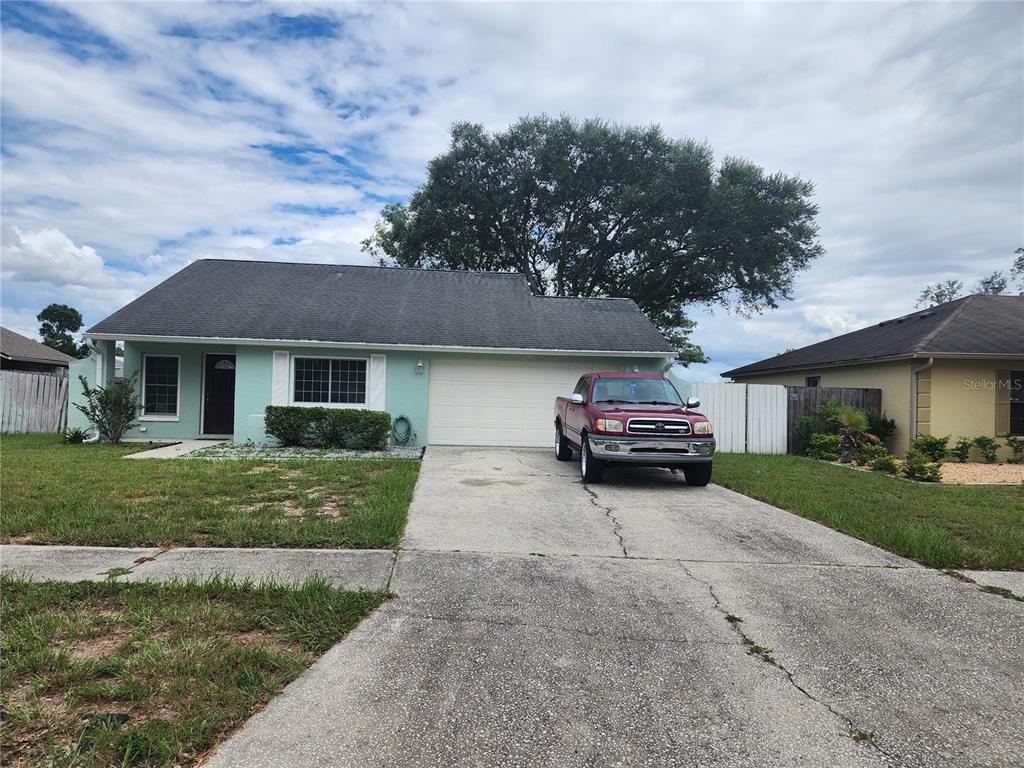 1205 Windhorst Ridge Drive Brandon, FL 33510 - Photo 1 of 1 a car parked in front of a house and a small yard