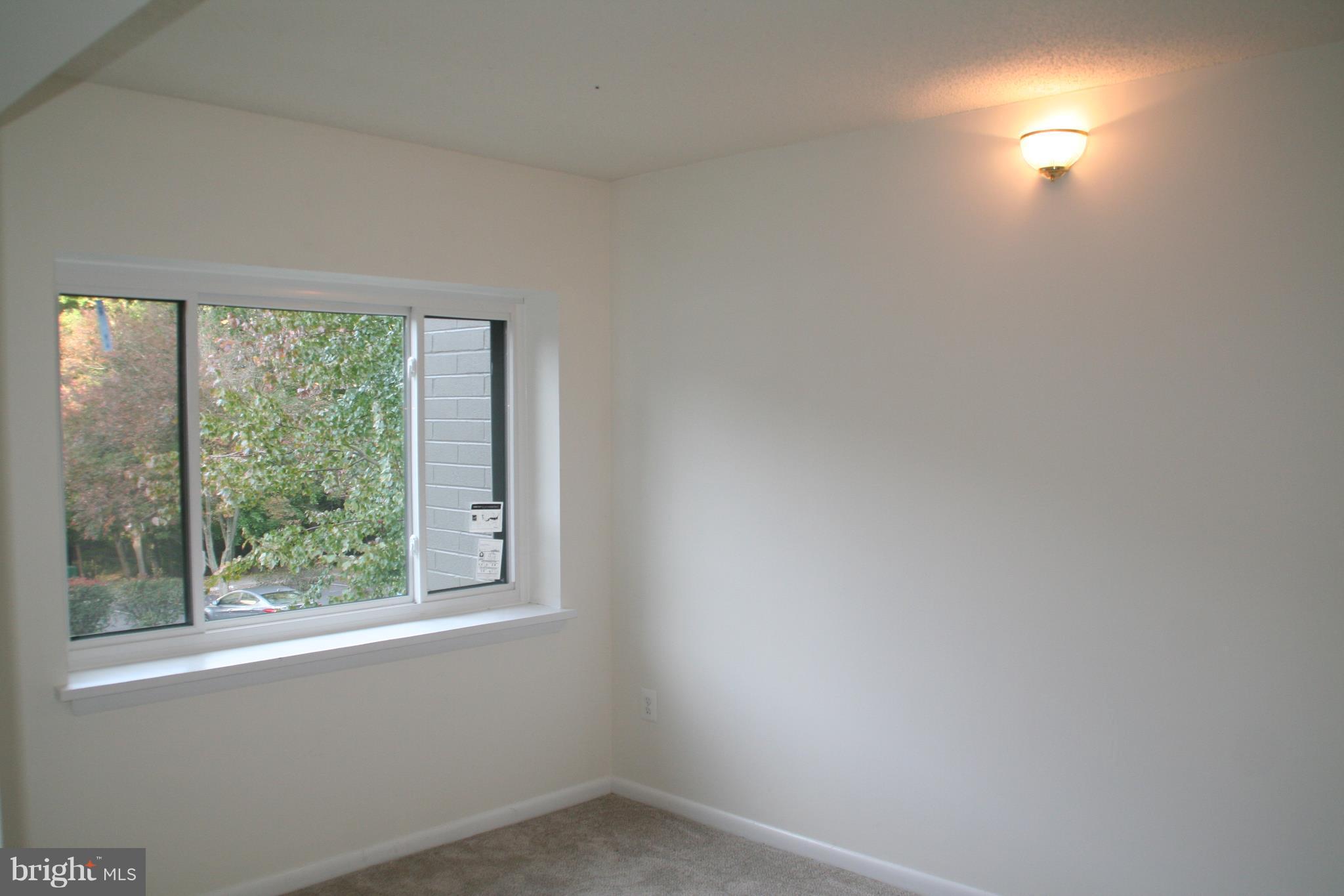 2216 Springwood Drive, Unit 102 Reston, VA 20191 - Photo 5 of 19 a room with a window