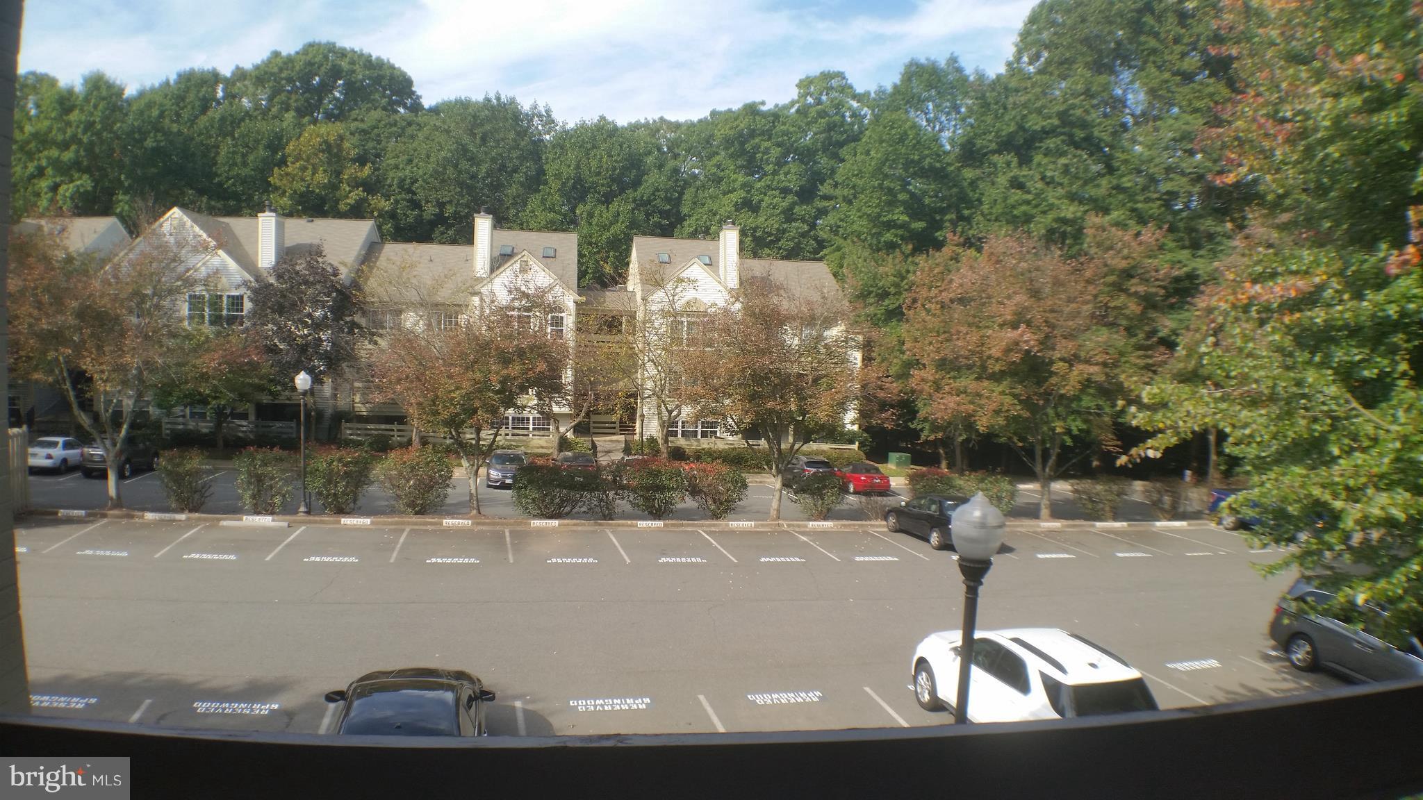 2216 Springwood Drive, Unit 102 Reston, VA 20191 - Photo 7 of 19 a view of a lake from a balcony