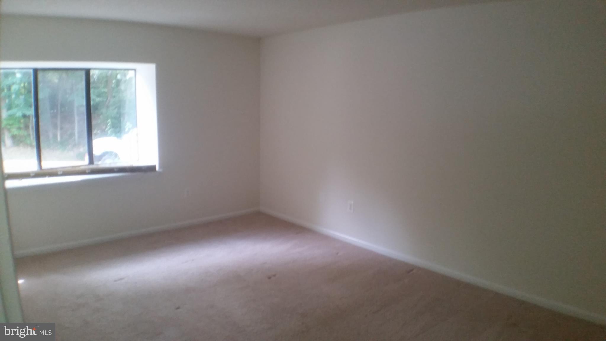 2216 Springwood Drive, Unit 102 Reston, VA 20191 - Photo 9 of 19 an empty room with a window