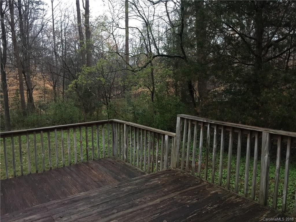 8420 Starnes Randall Road Charlotte, NC 28215 - Photo 12 of 13 a balcony with trees in front of it