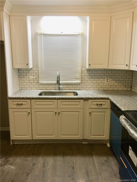8420 Starnes Randall Road Charlotte, NC 28215 - Photo 3 of 13 a kitchen with stainless steel appliances granite countertop a sink and a stove
