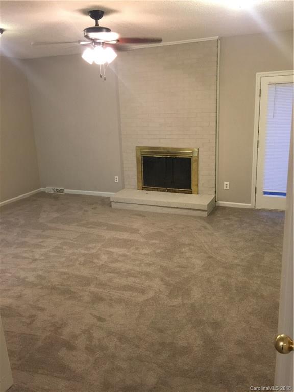 8420 Starnes Randall Road Charlotte, NC 28215 - Photo 8 of 13 a view of empty room with a fireplace