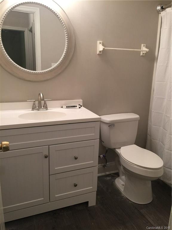 8420 Starnes Randall Road Charlotte, NC 28215 - Photo 10 of 13 a bathroom with a toilet and a sink