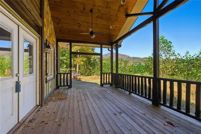 a spacious bathroom with a granite countertop sink and a mirror