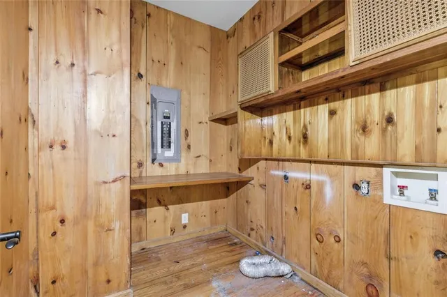 a bathroom with a granite countertop sink a toilet a mirror and bathtub