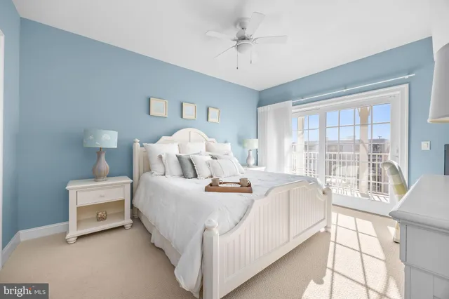 a dining room with furniture a chandelier and kitchen view