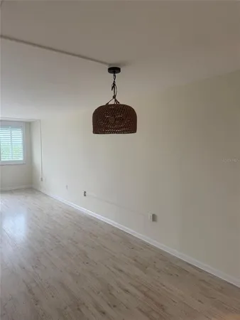 a kitchen with a refrigerator sink and cabinets
