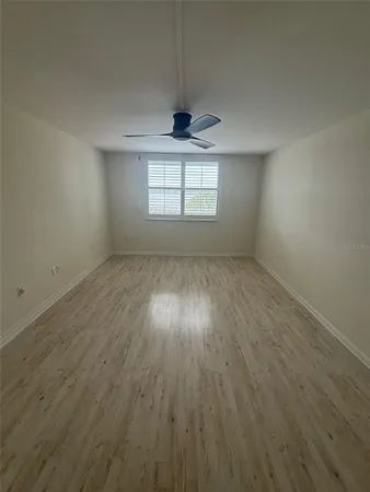 a view of an empty room and wooden floor