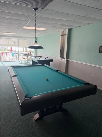 a view of an empty room and wooden floor