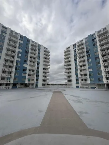 a living room with furniture and a mirror