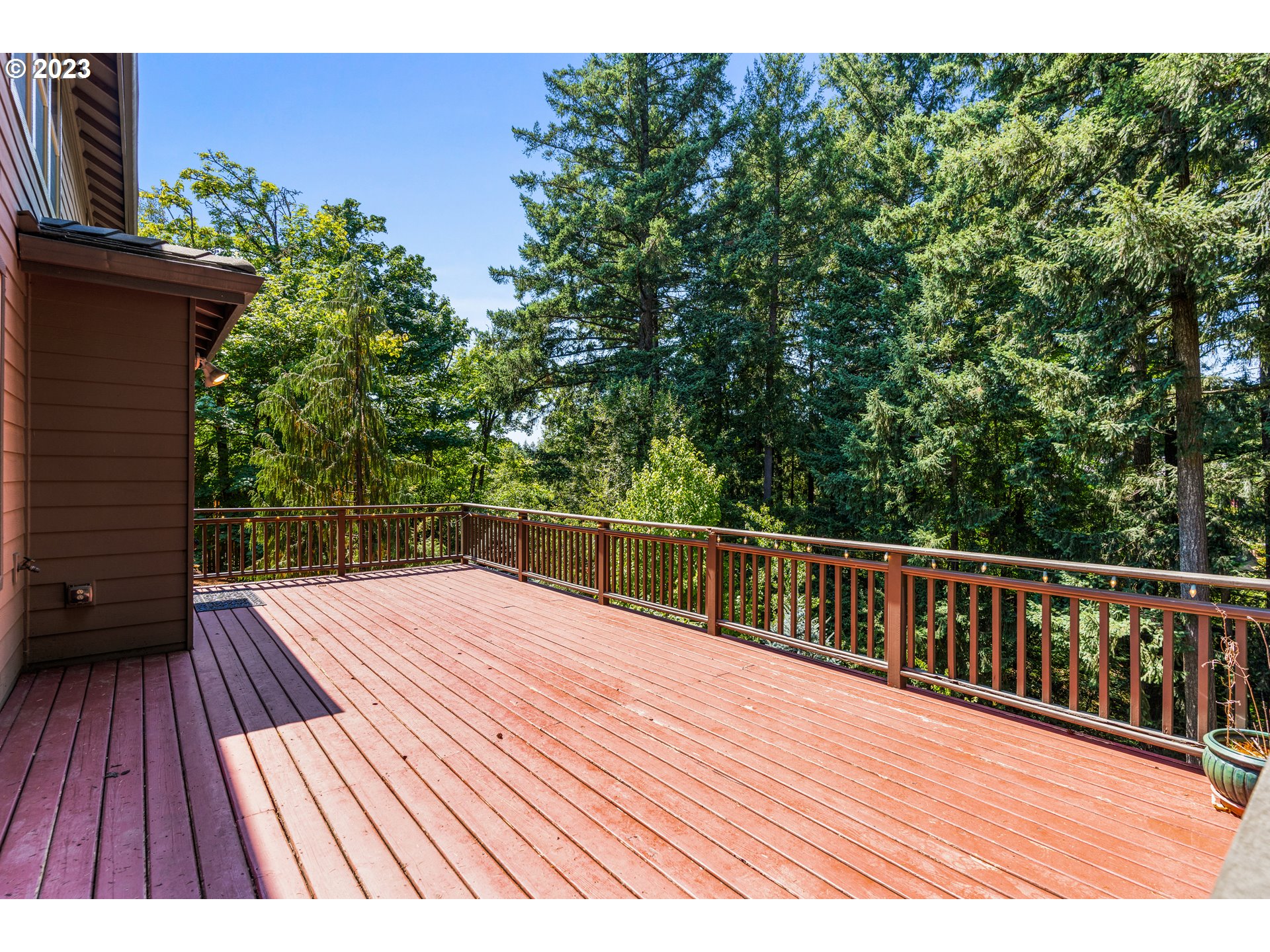 18281 Southwest Florendo Lane Beaverton, OR 97007 - Photo 18 of 47 a view of balcony with wooden floor and fence