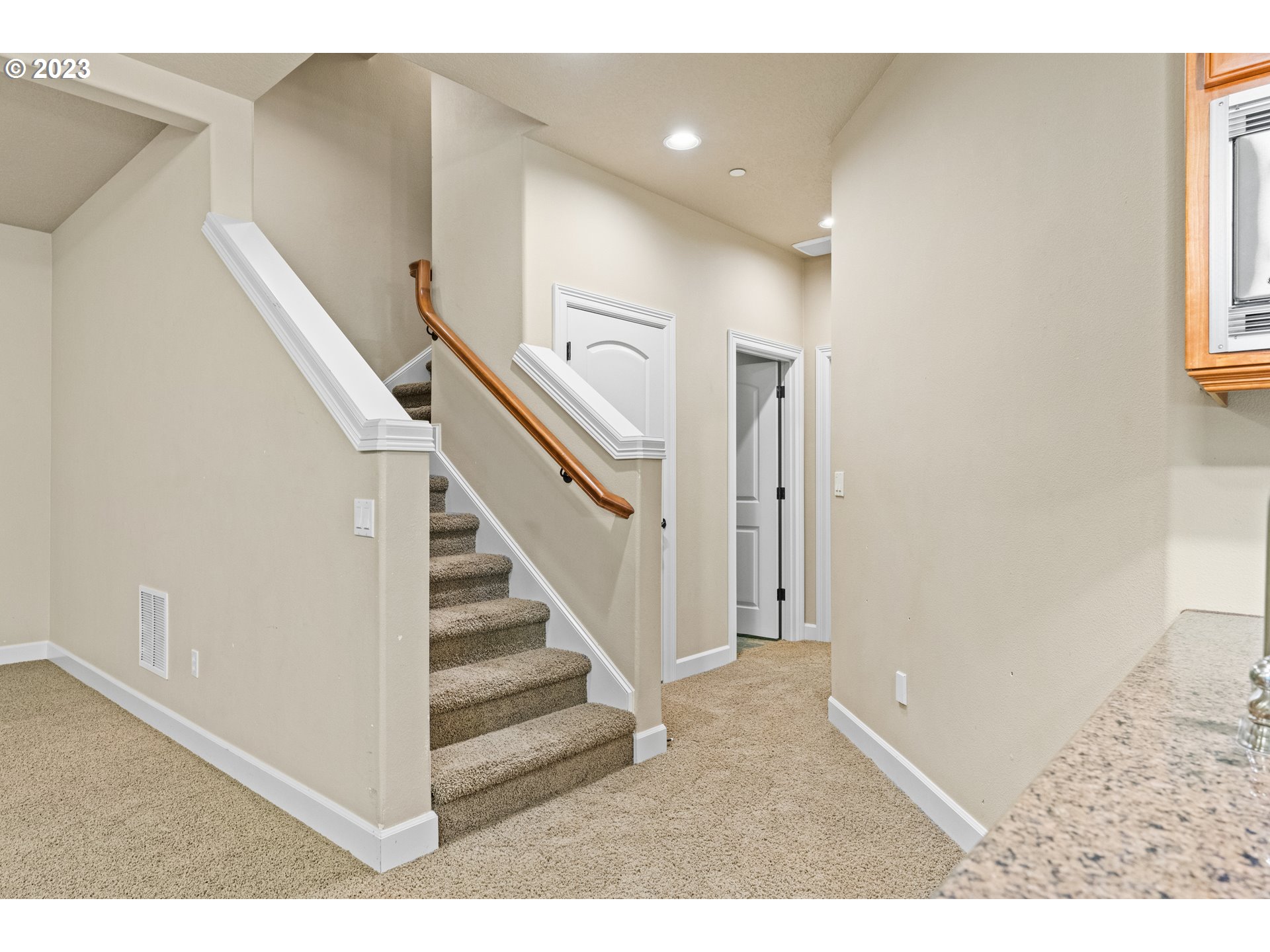 18281 Southwest Florendo Lane Beaverton, OR 97007 - Photo 19 of 47 a view of entryway and hall with wooden floor