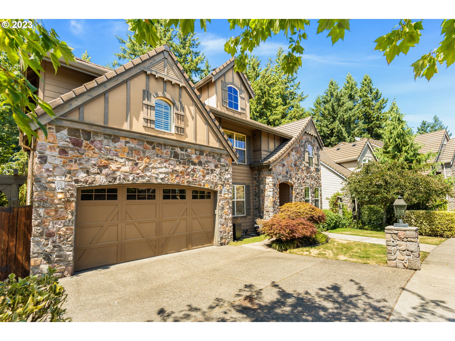 18281 Southwest Florendo Lane Beaverton, OR 97007 - Photo 2 of 47 a view of a house with a yard