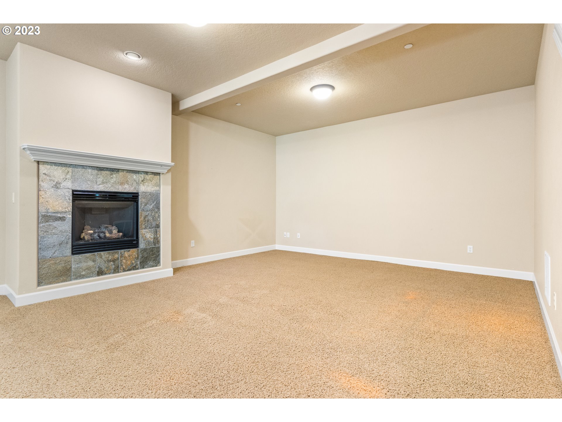 18281 Southwest Florendo Lane Beaverton, OR 97007 - Photo 21 of 47 a view of an empty room with a fireplace