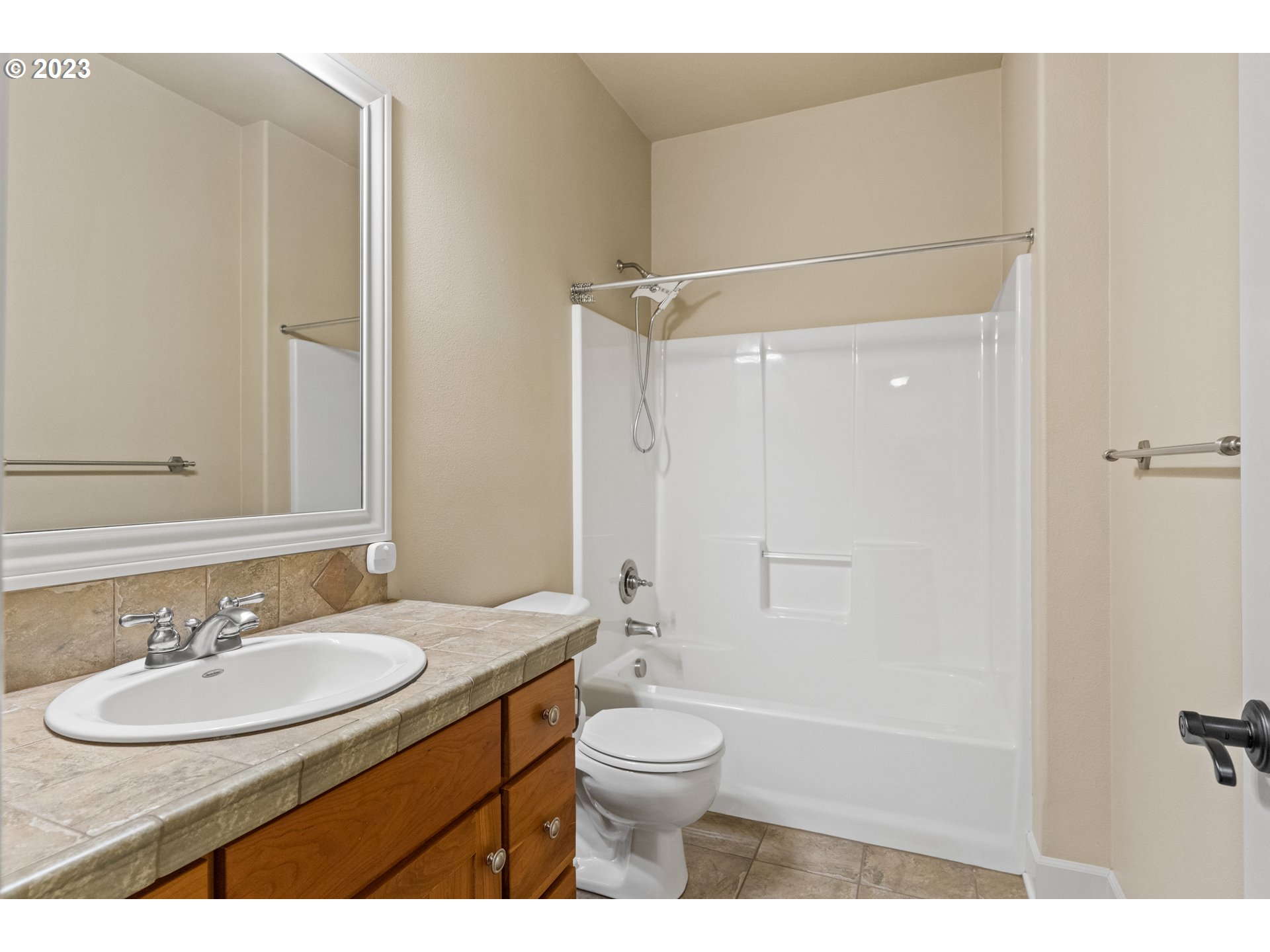 18281 Southwest Florendo Lane Beaverton, OR 97007 - Photo 23 of 47 a bathroom with a sink toilet a mirror and shower