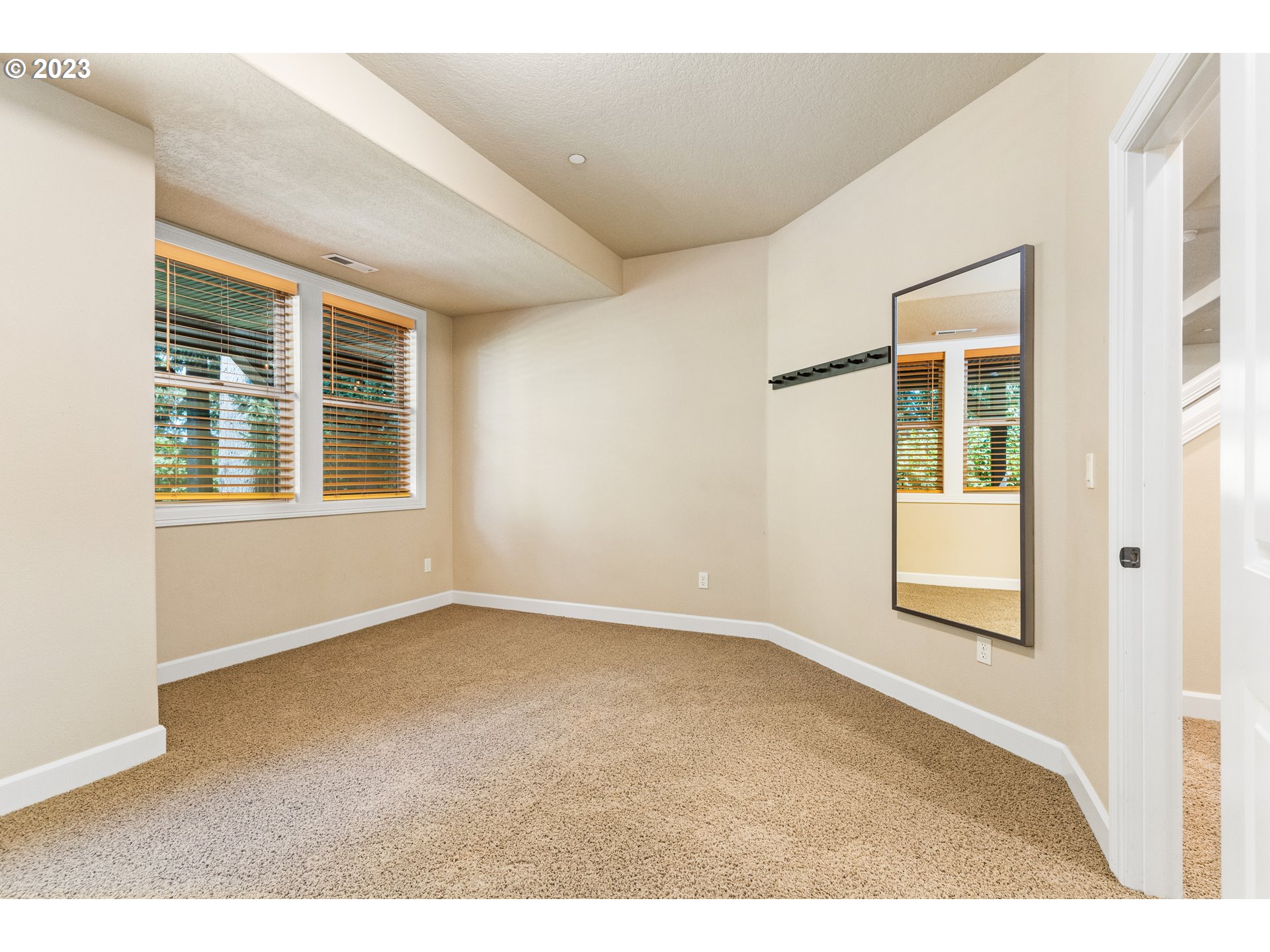 18281 Southwest Florendo Lane Beaverton, OR 97007 - Photo 26 of 47 a view of an empty room with a window