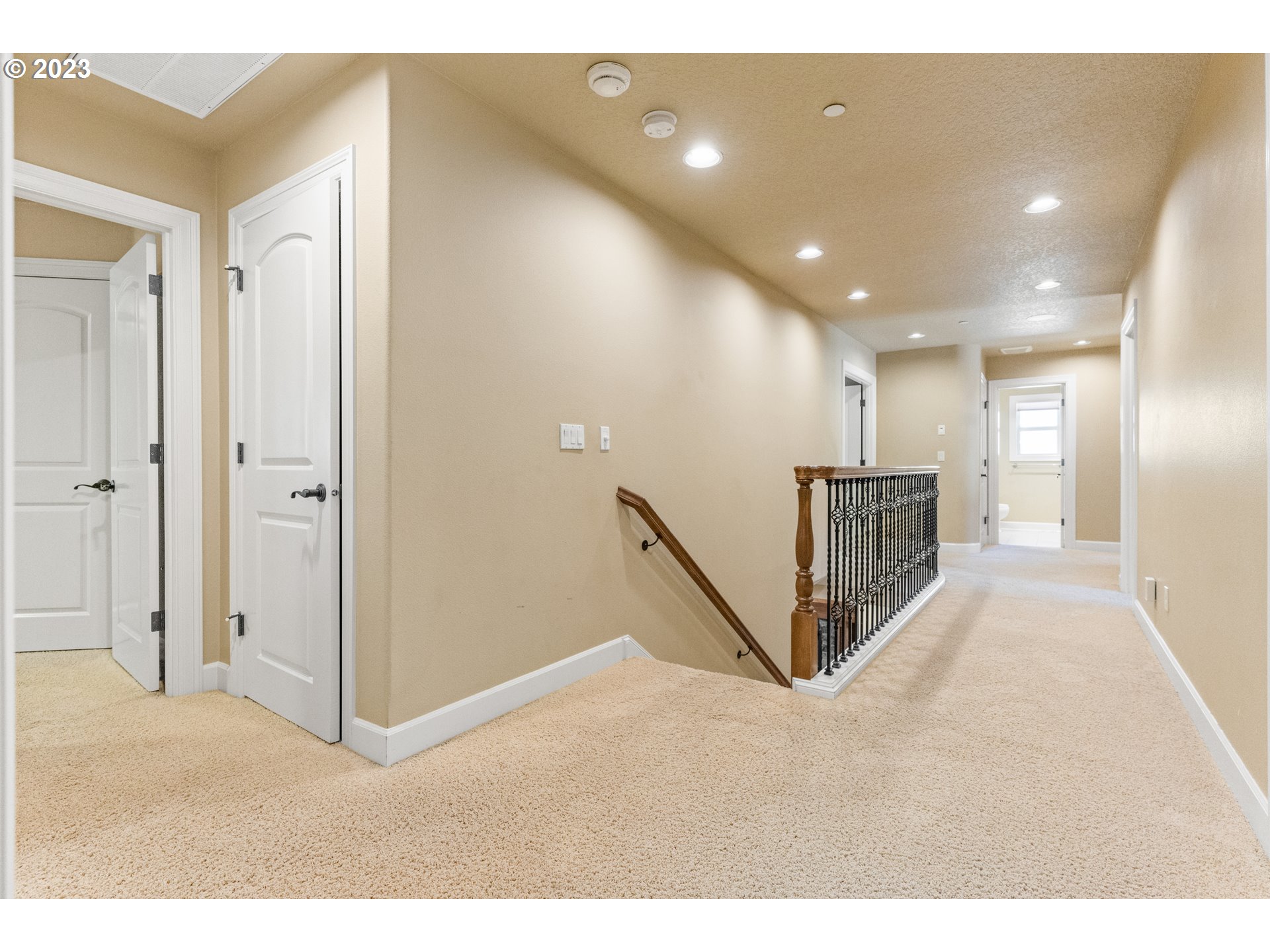 18281 Southwest Florendo Lane Beaverton, OR 97007 - Photo 27 of 47 a view of a hallway with a living room