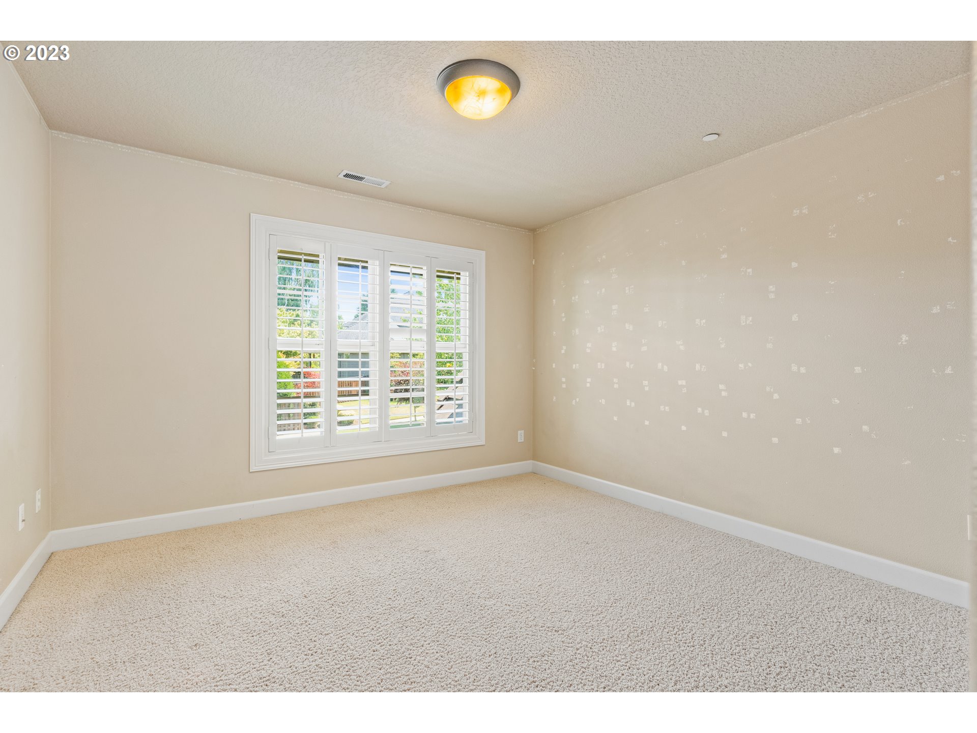 18281 Southwest Florendo Lane Beaverton, OR 97007 - Photo 34 of 47 a view of an empty room with a window