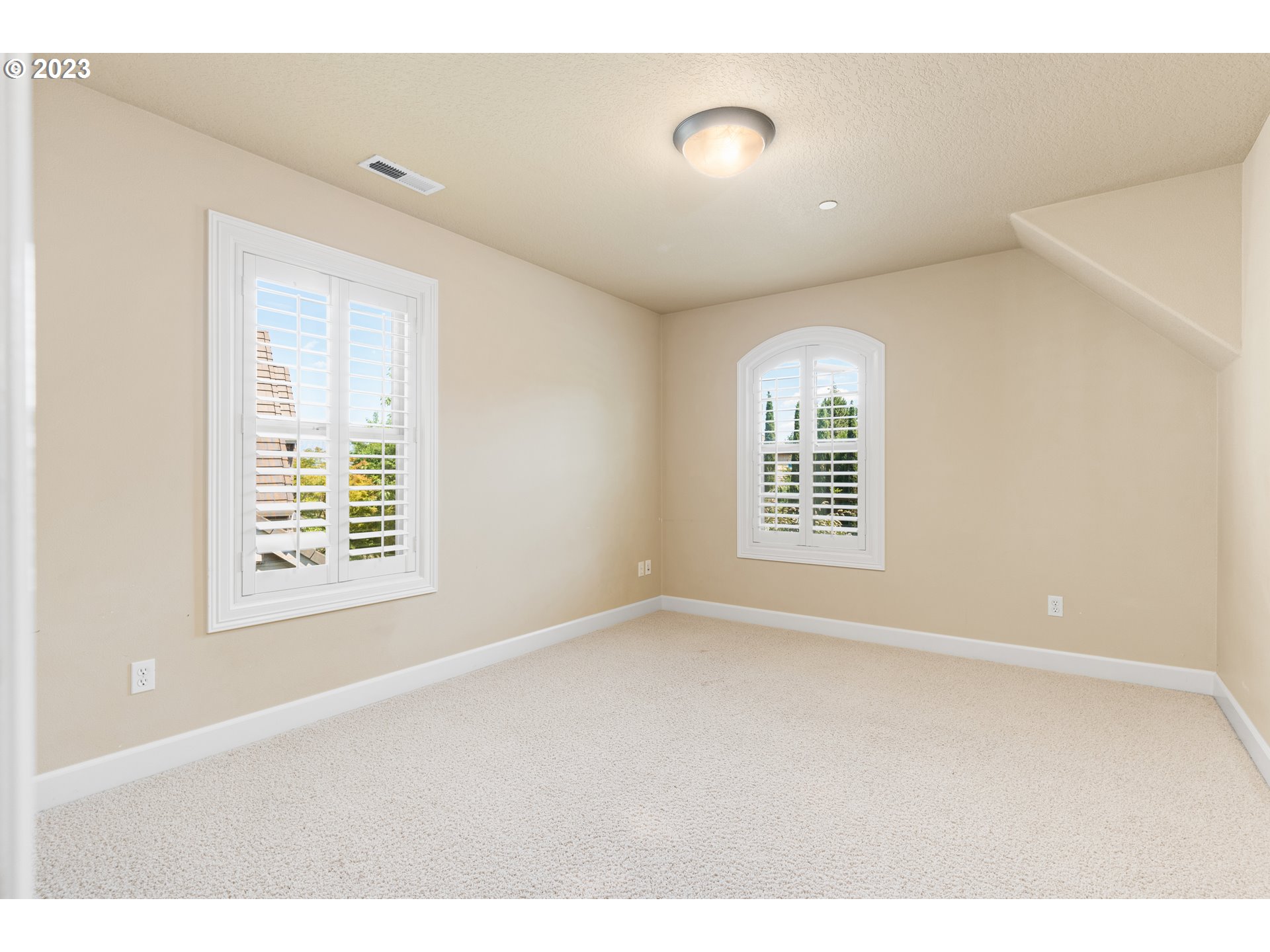 18281 Southwest Florendo Lane Beaverton, OR 97007 - Photo 36 of 47 a view of an empty room with a window