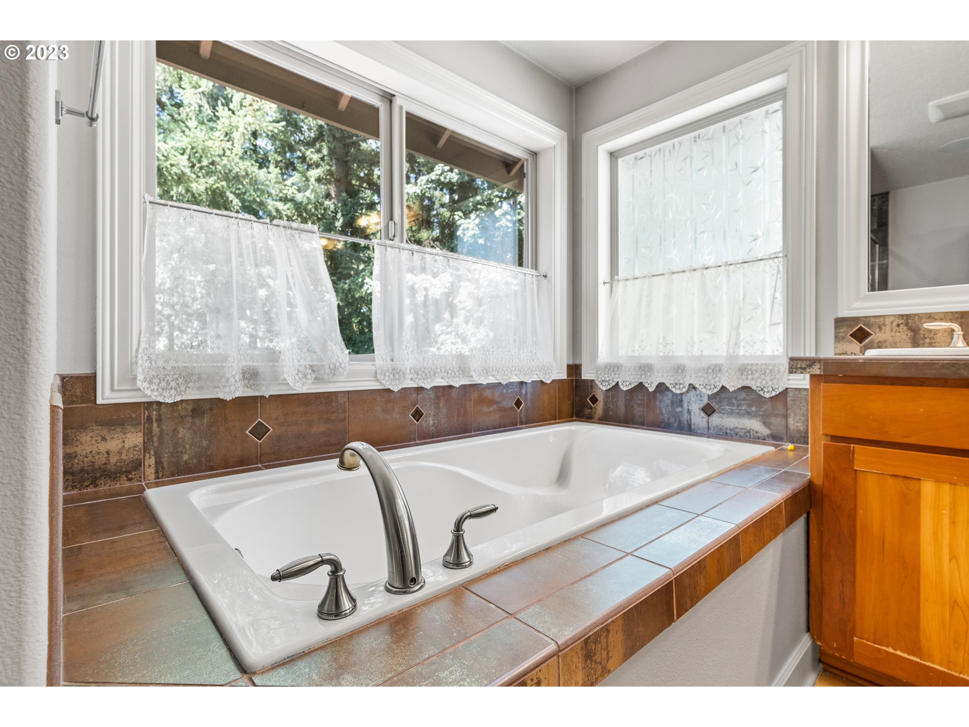 18281 Southwest Florendo Lane Beaverton, OR 97007 - Photo 41 of 47 a bath tub sitting next to a window