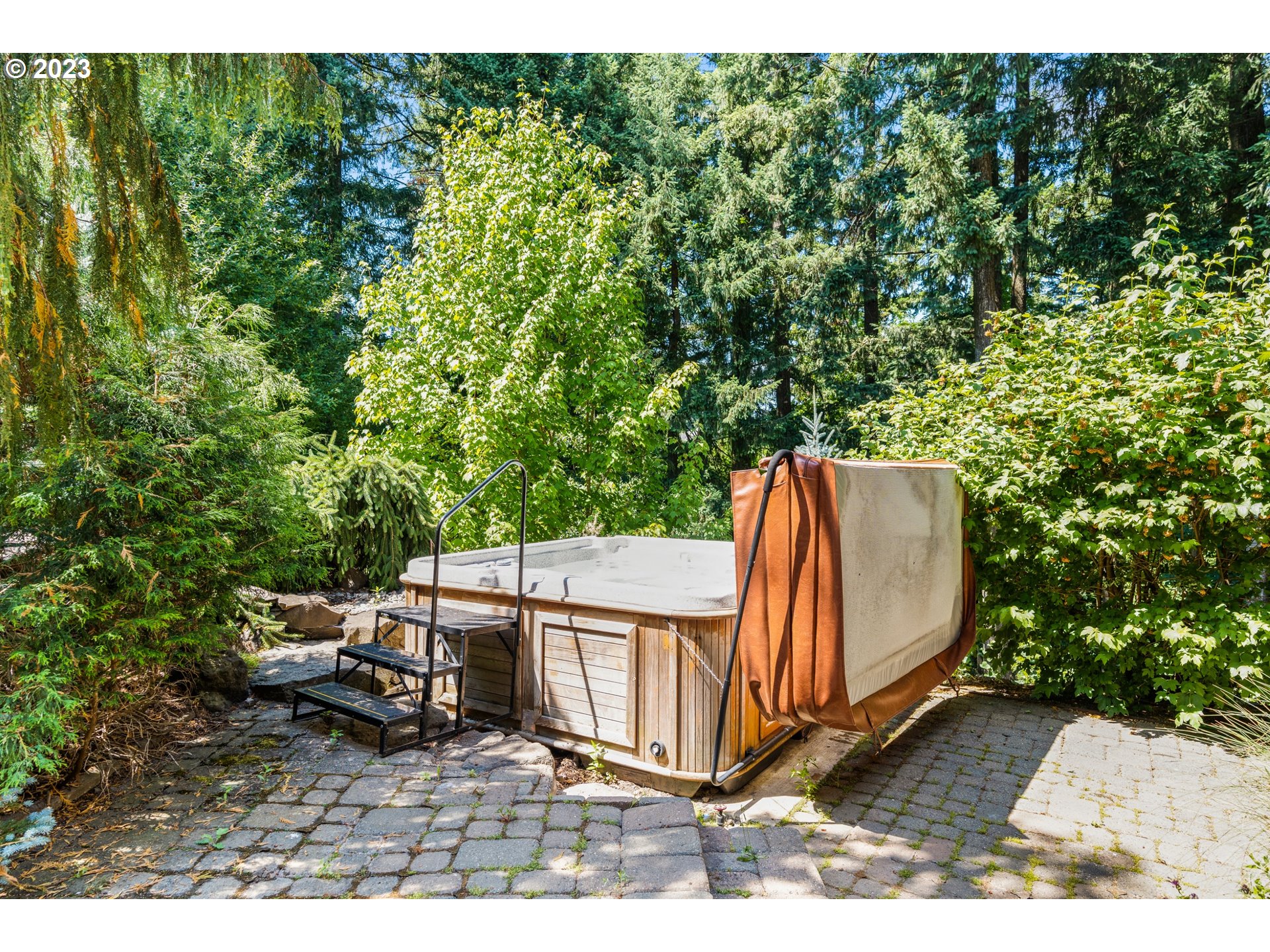 18281 Southwest Florendo Lane Beaverton, OR 97007 - Photo 44 of 47 a view of a backyard with wooden fence and large trees