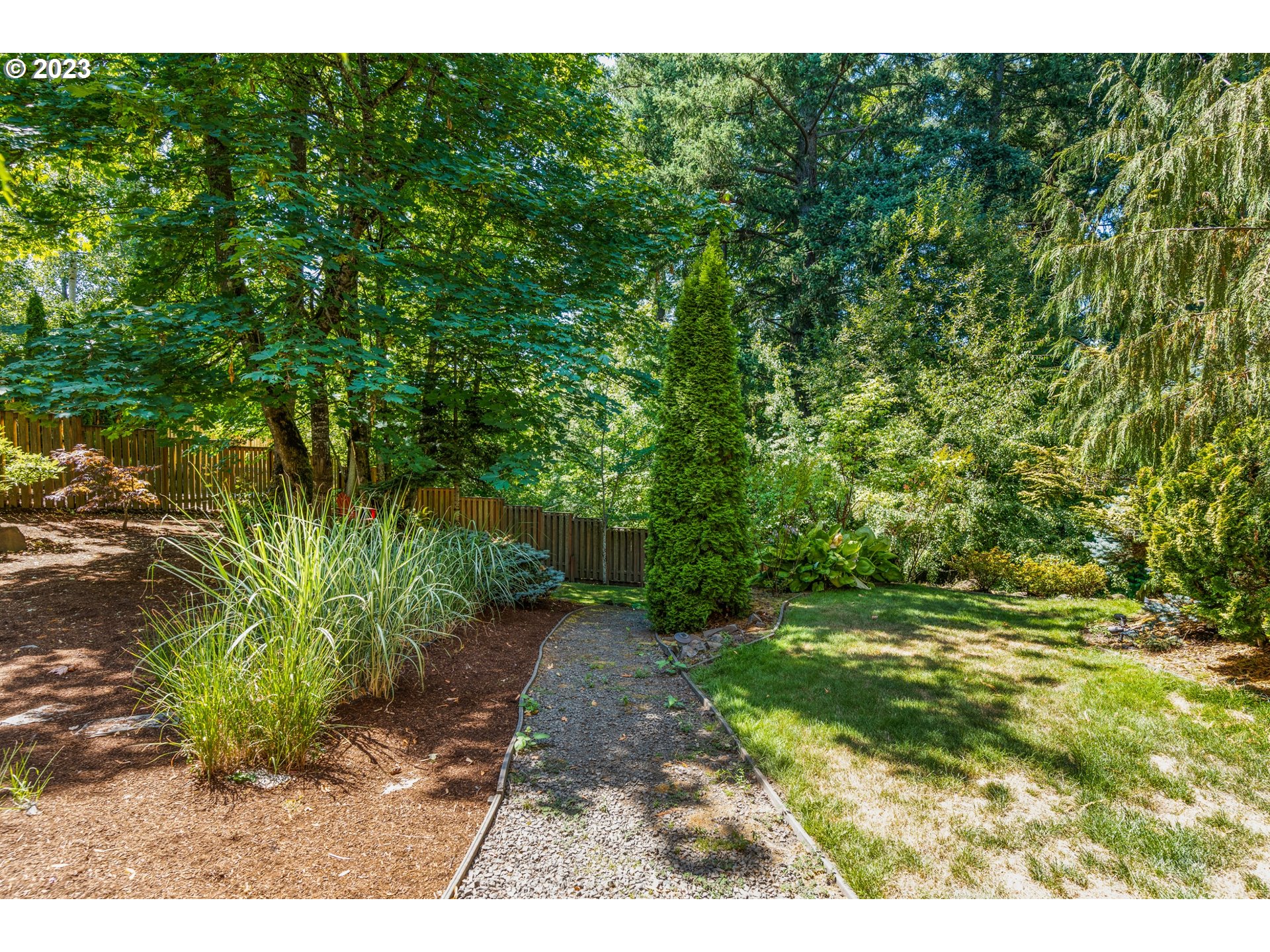 18281 Southwest Florendo Lane Beaverton, OR 97007 - Photo 45 of 47 a view of a yard with plants and large trees
