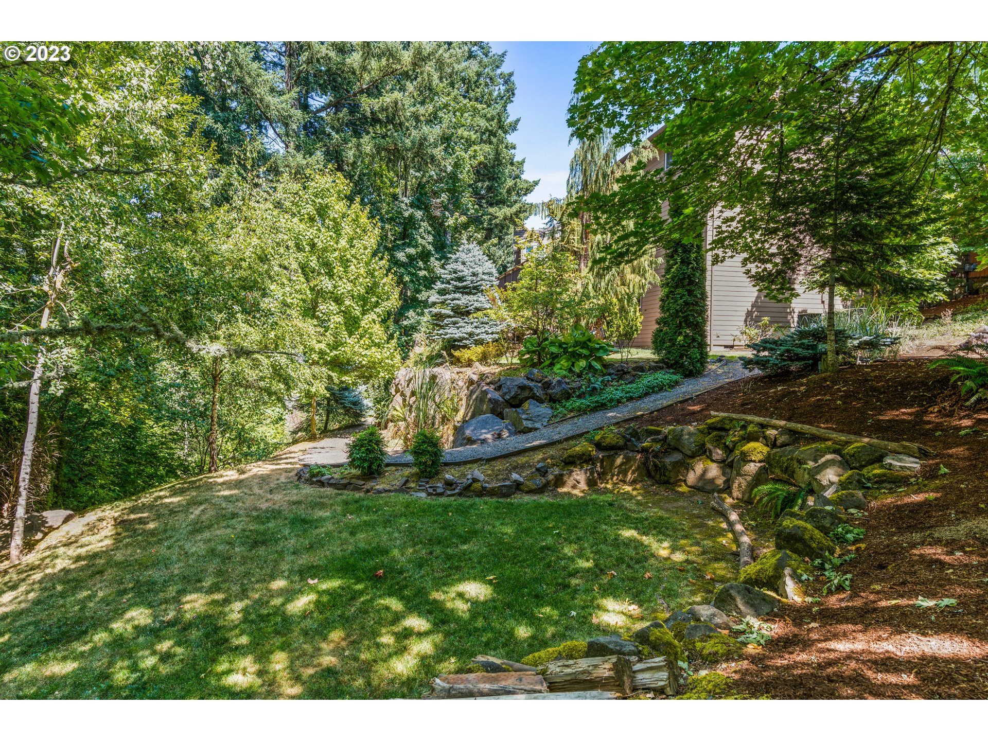 18281 Southwest Florendo Lane Beaverton, OR 97007 - Photo 47 of 47 a backyard of a house with lots of green space