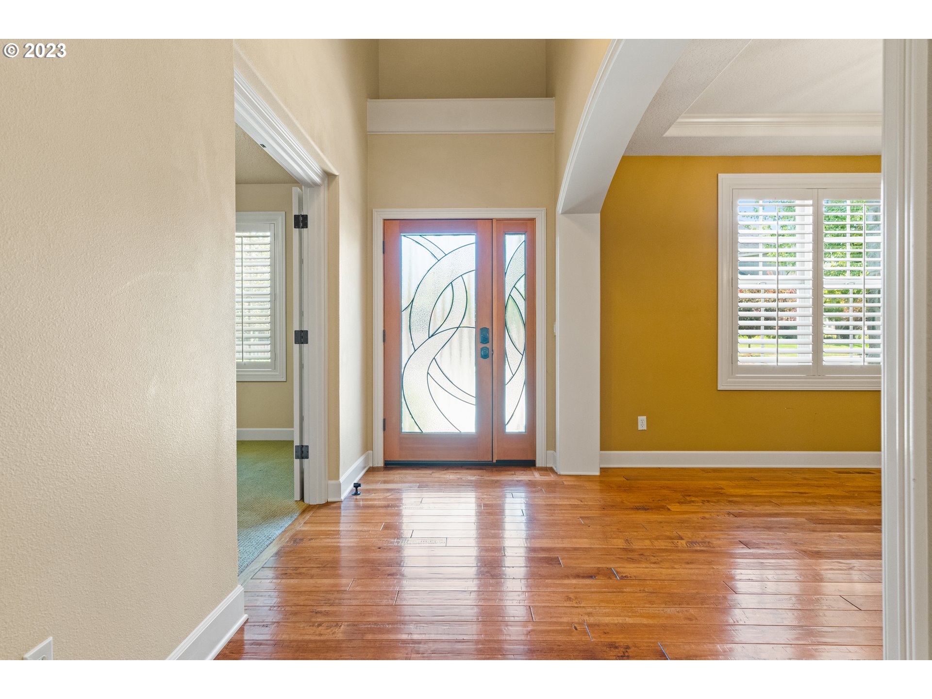 18281 Southwest Florendo Lane Beaverton, OR 97007 - Photo 5 of 47 a view of an empty room with wooden floor and a window