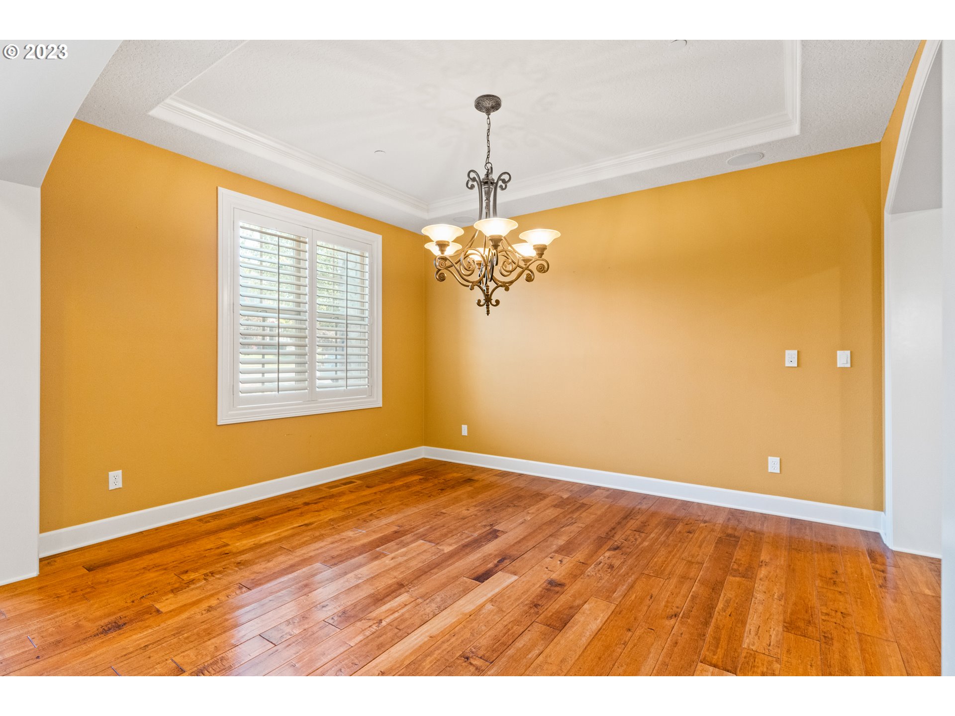 18281 Southwest Florendo Lane Beaverton, OR 97007 - Photo 6 of 47 a view of empty room with wooden floor and fan