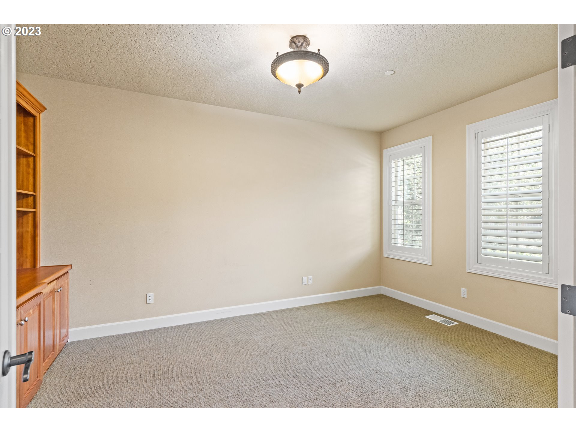 18281 Southwest Florendo Lane Beaverton, OR 97007 - Photo 7 of 47 a view of an empty room with a window