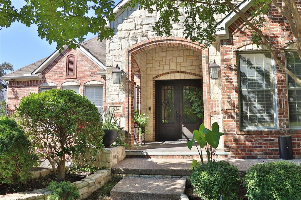 1634 Oak Ridge Drive Corinth, TX 76210 - Photo 3 of 40 a front view of a house with a yard