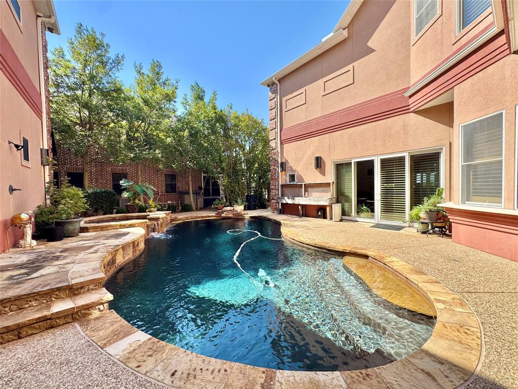 1634 Oak Ridge Drive Corinth, TX 76210 - Photo 32 of 40 a view of a swimming pool with sitting area
