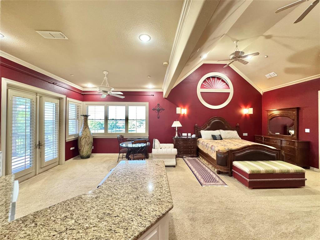 1634 Oak Ridge Drive Corinth, TX 76210 - Photo 8 of 40 a bedroom with furniture and a large window