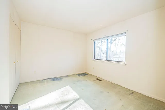 a view of a room that has a window in it