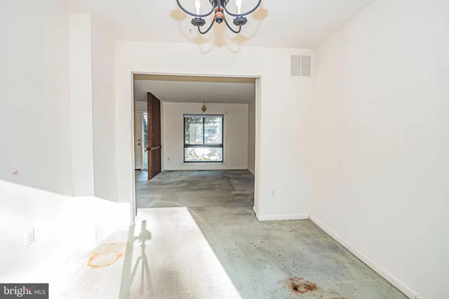 a view of a kitchen from the hallway