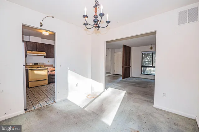 a kitchen with a stove a sink and a refrigerator