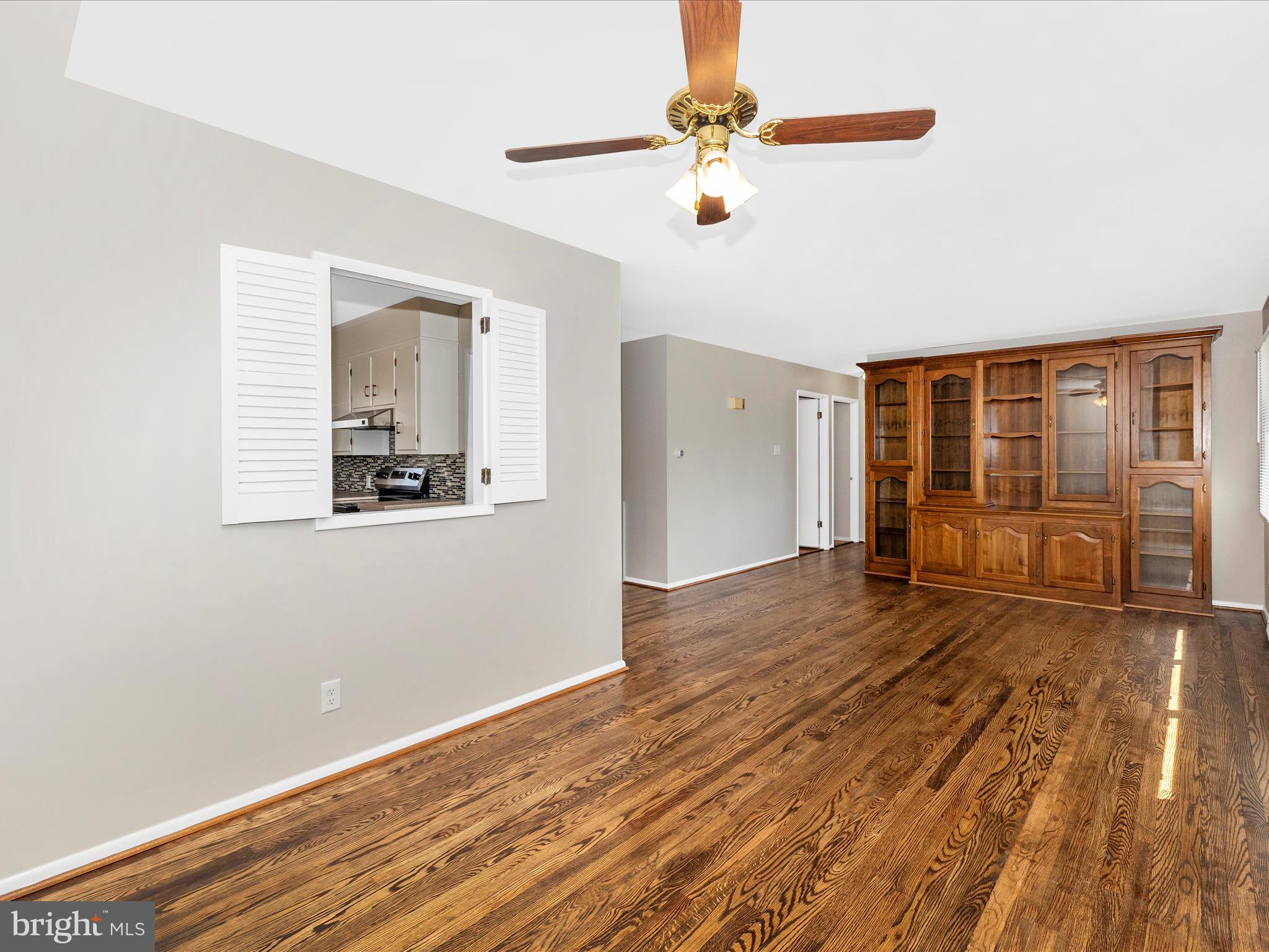 20731 Emerald Drive Hagerstown, MD 21742 - Photo 12 of 54 a view of an empty room with wooden floor and a window