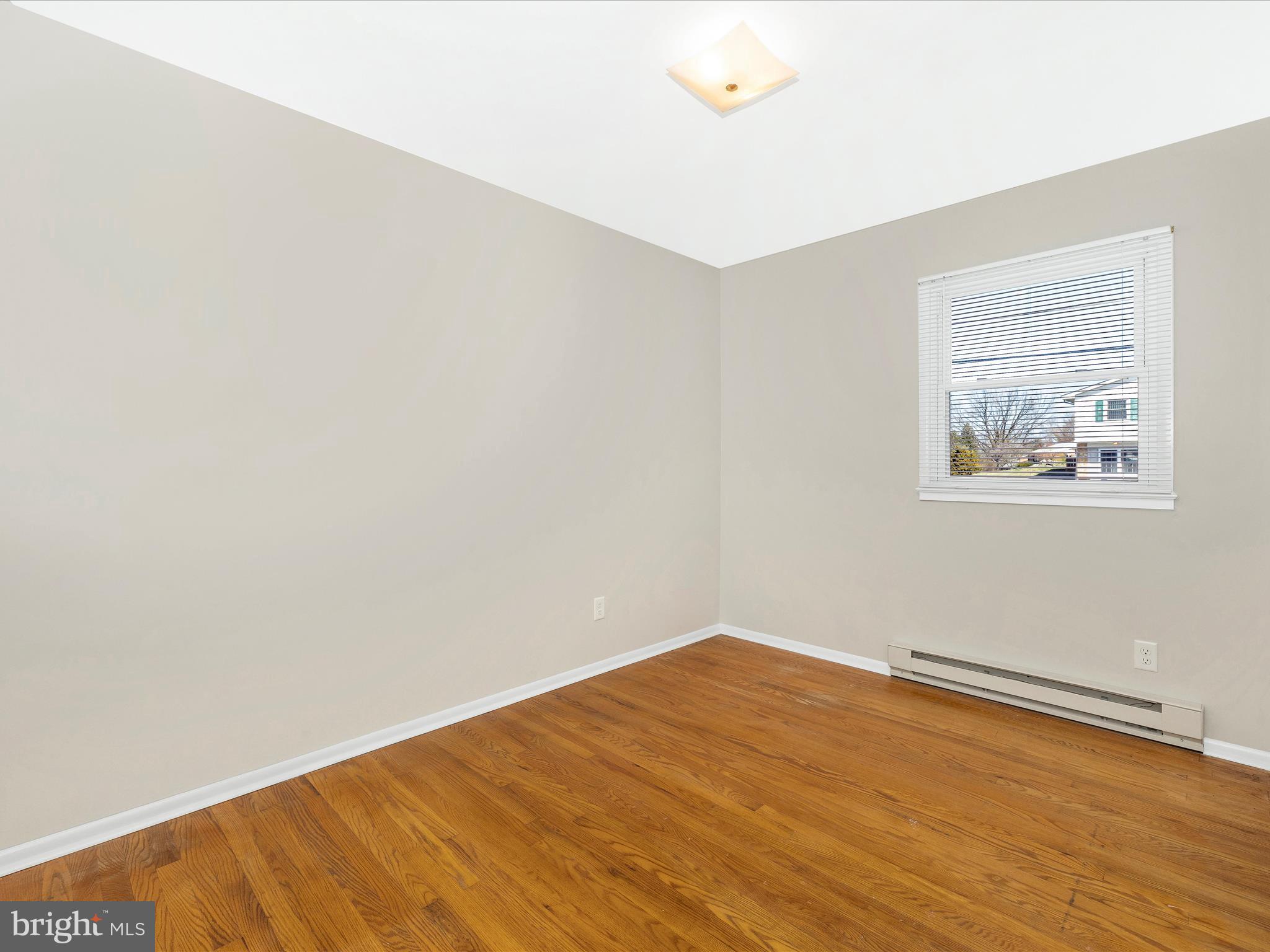 20731 Emerald Drive Hagerstown, MD 21742 - Photo 25 of 54 an empty room with wooden floor and windows