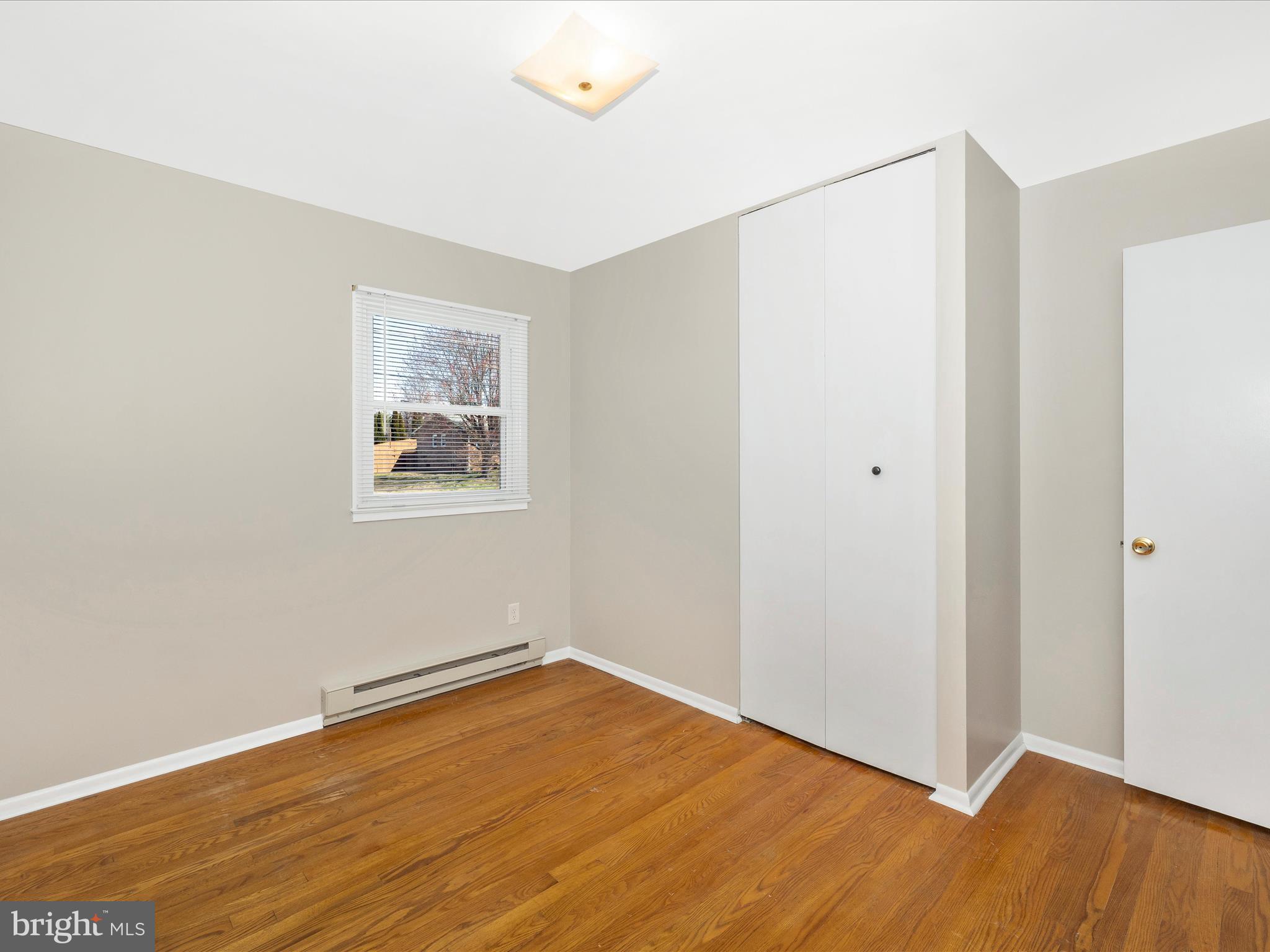 20731 Emerald Drive Hagerstown, MD 21742 - Photo 26 of 54 a view of empty room with wooden floor