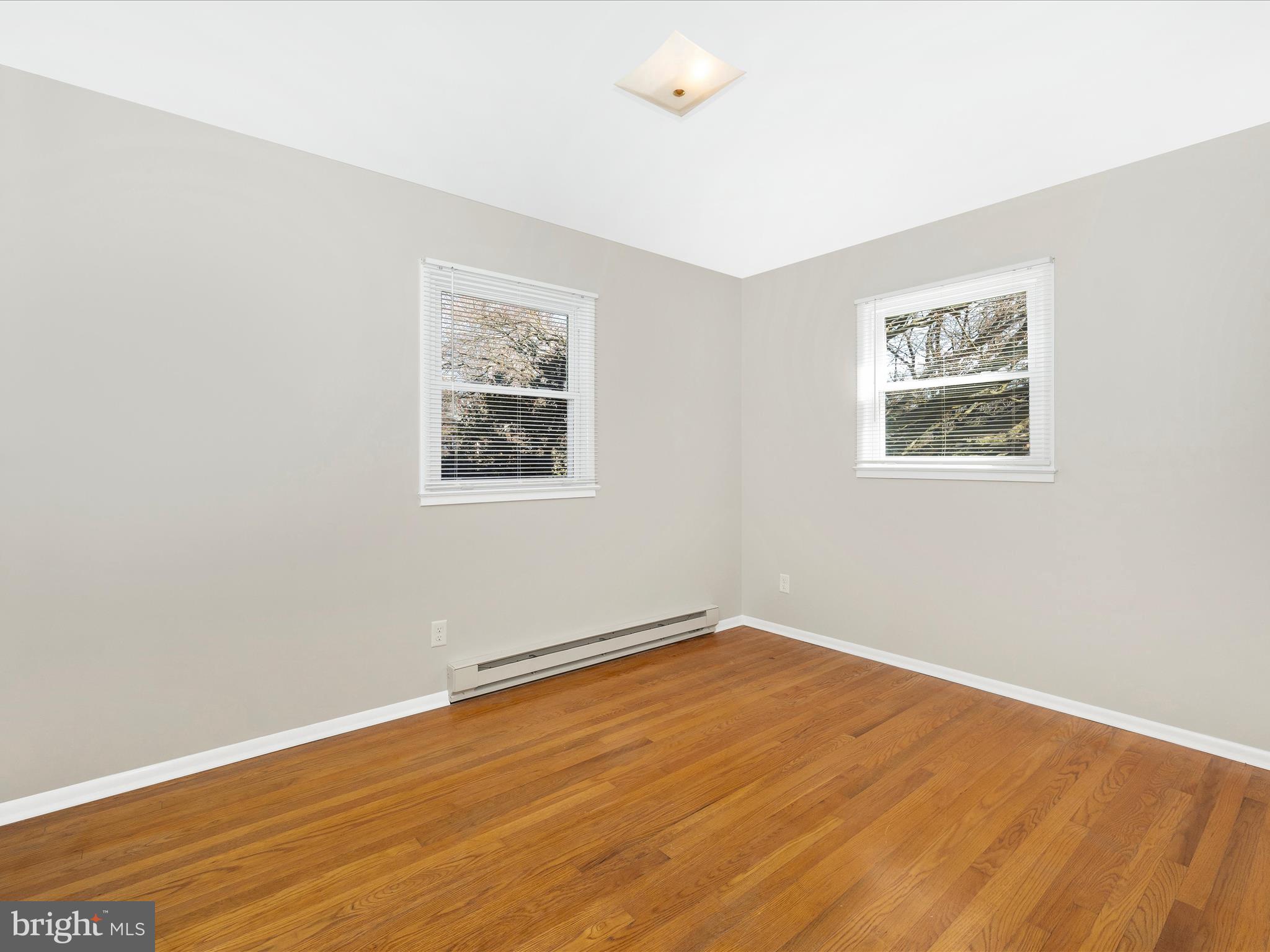 20731 Emerald Drive Hagerstown, MD 21742 - Photo 27 of 54 an empty room with wooden floor and windows