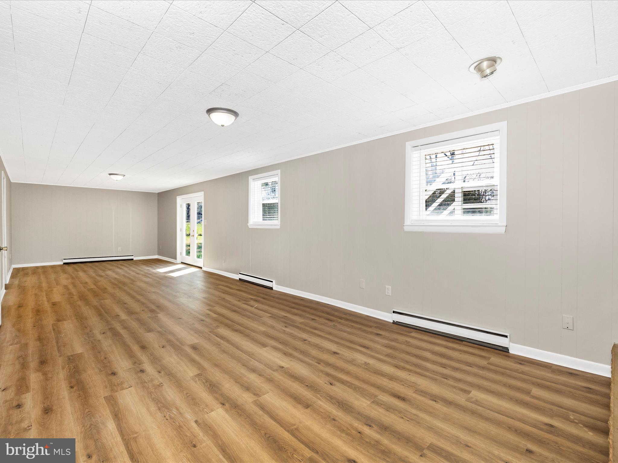 20731 Emerald Drive Hagerstown, MD 21742 - Photo 30 of 54 an empty room with wooden floor and windows