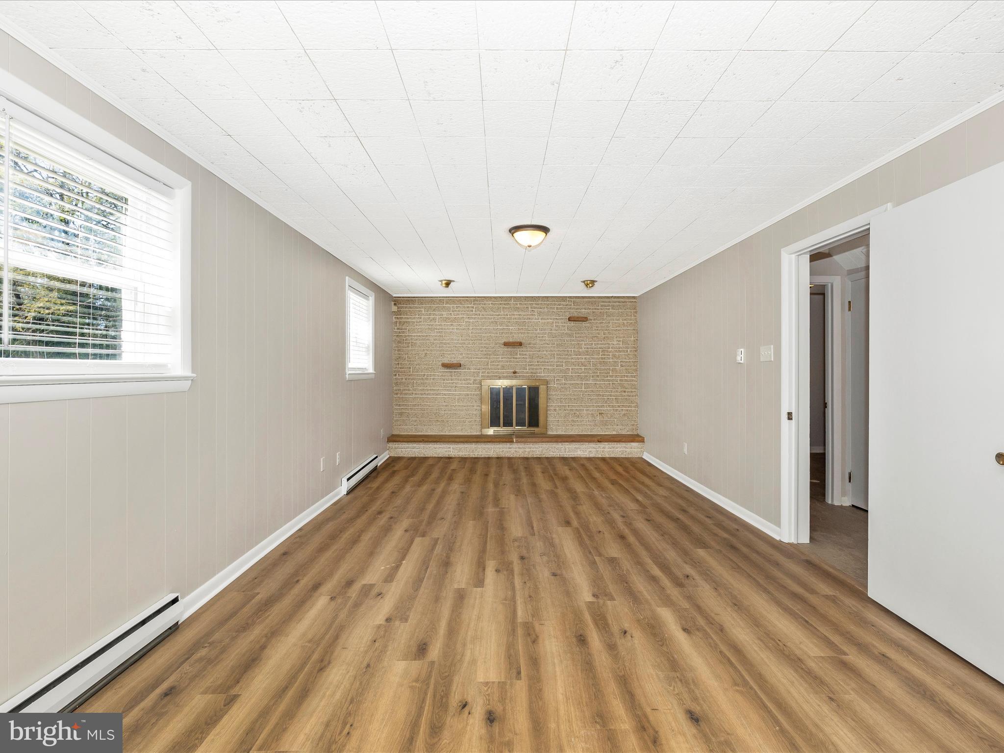 20731 Emerald Drive Hagerstown, MD 21742 - Photo 32 of 54 a view of a room with wooden floor and furniture
