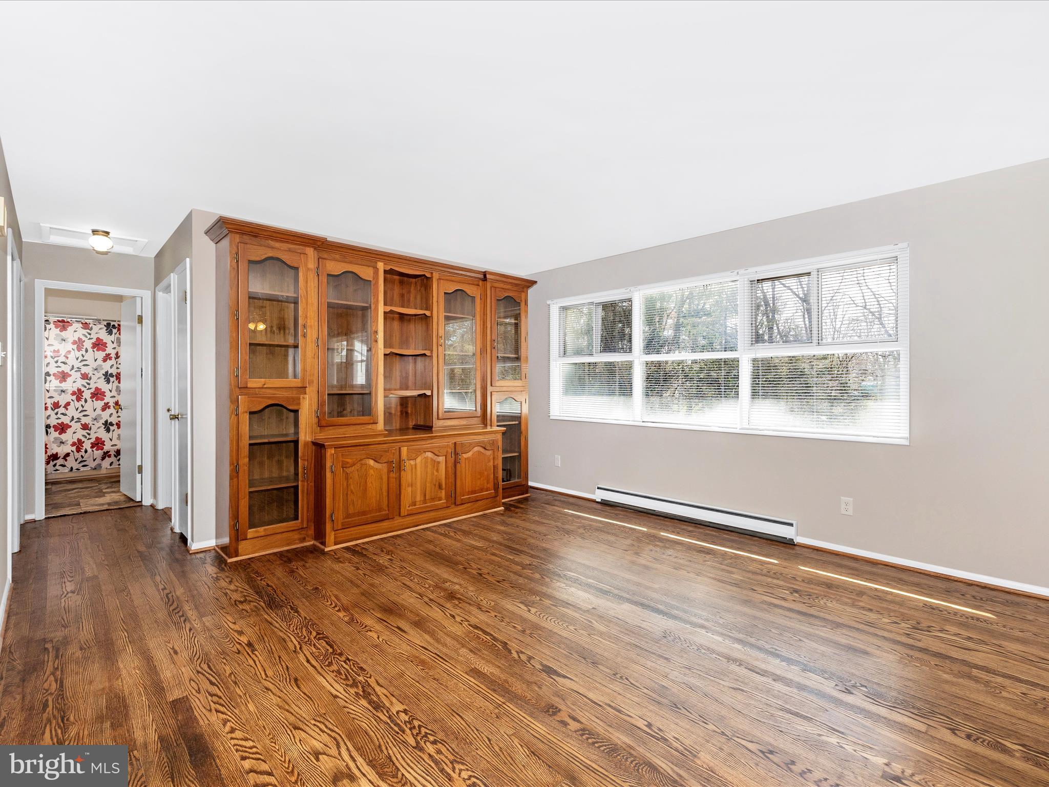 20731 Emerald Drive Hagerstown, MD 21742 - Photo 6 of 54 an empty room with wooden floor and windows