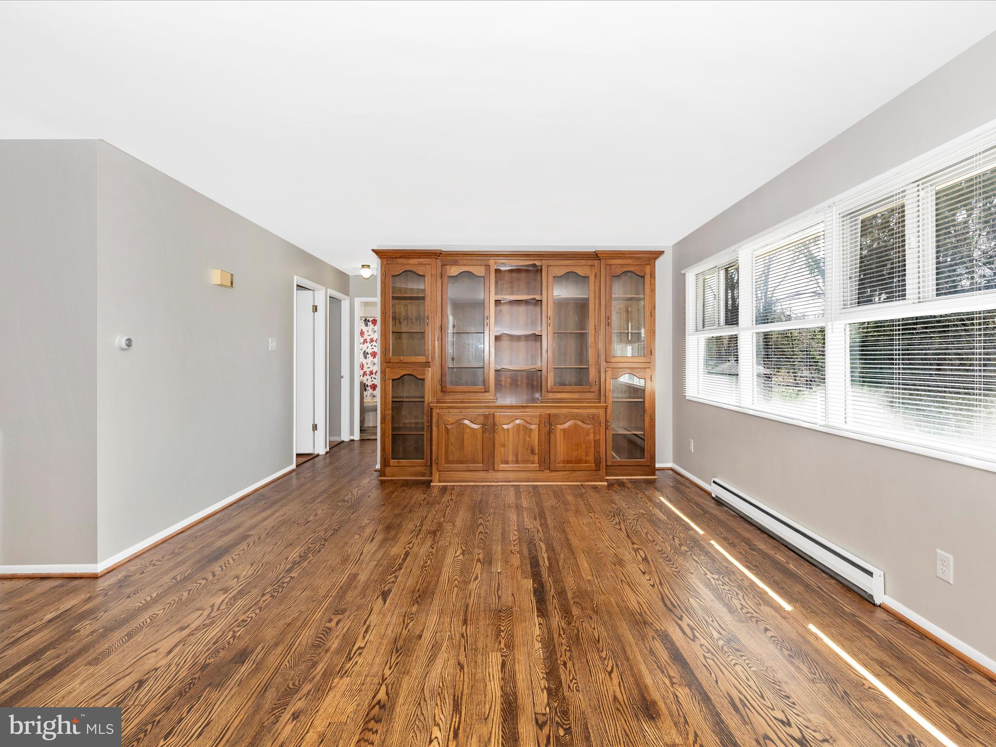 20731 Emerald Drive Hagerstown, MD 21742 - Photo 7 of 54 a view of an empty room with wooden floor and a window