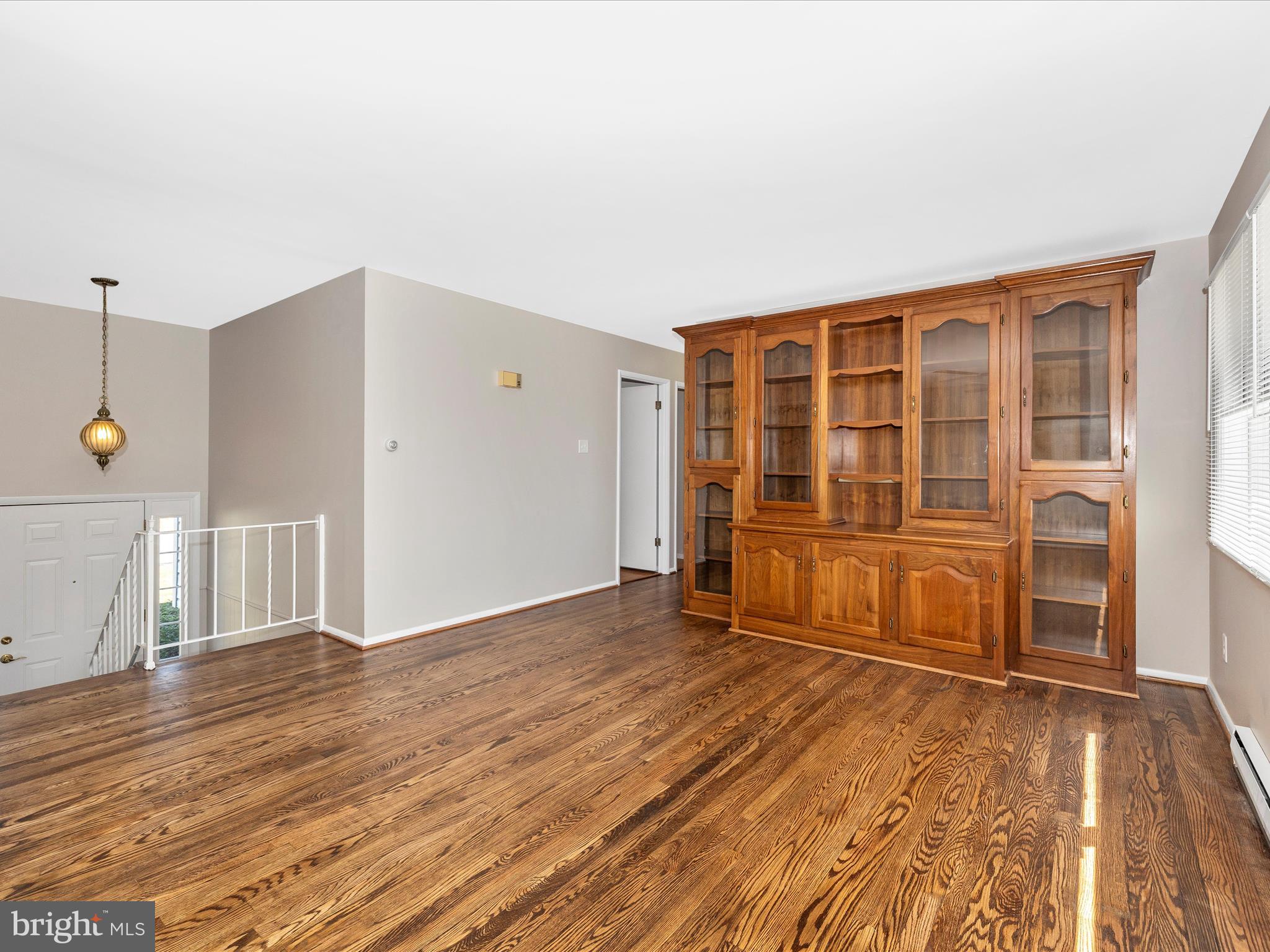 20731 Emerald Drive Hagerstown, MD 21742 - Photo 8 of 54 a view of empty room with wooden floor and door