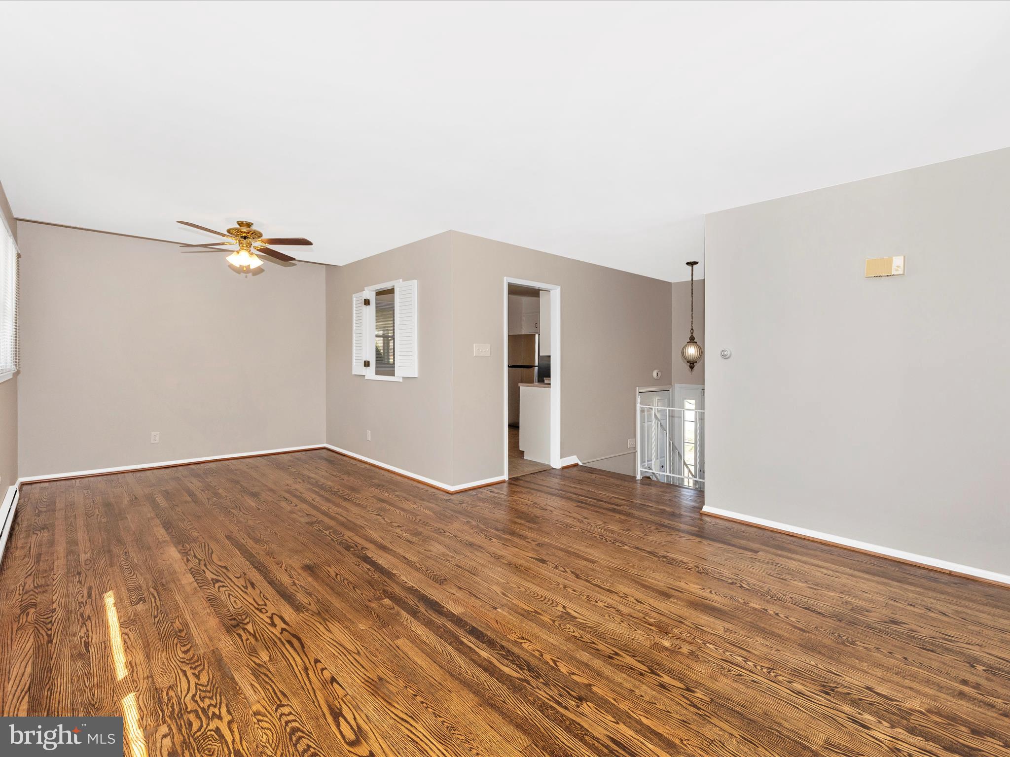 20731 Emerald Drive Hagerstown, MD 21742 - Photo 9 of 54 a view of an empty room with wooden floor and a window