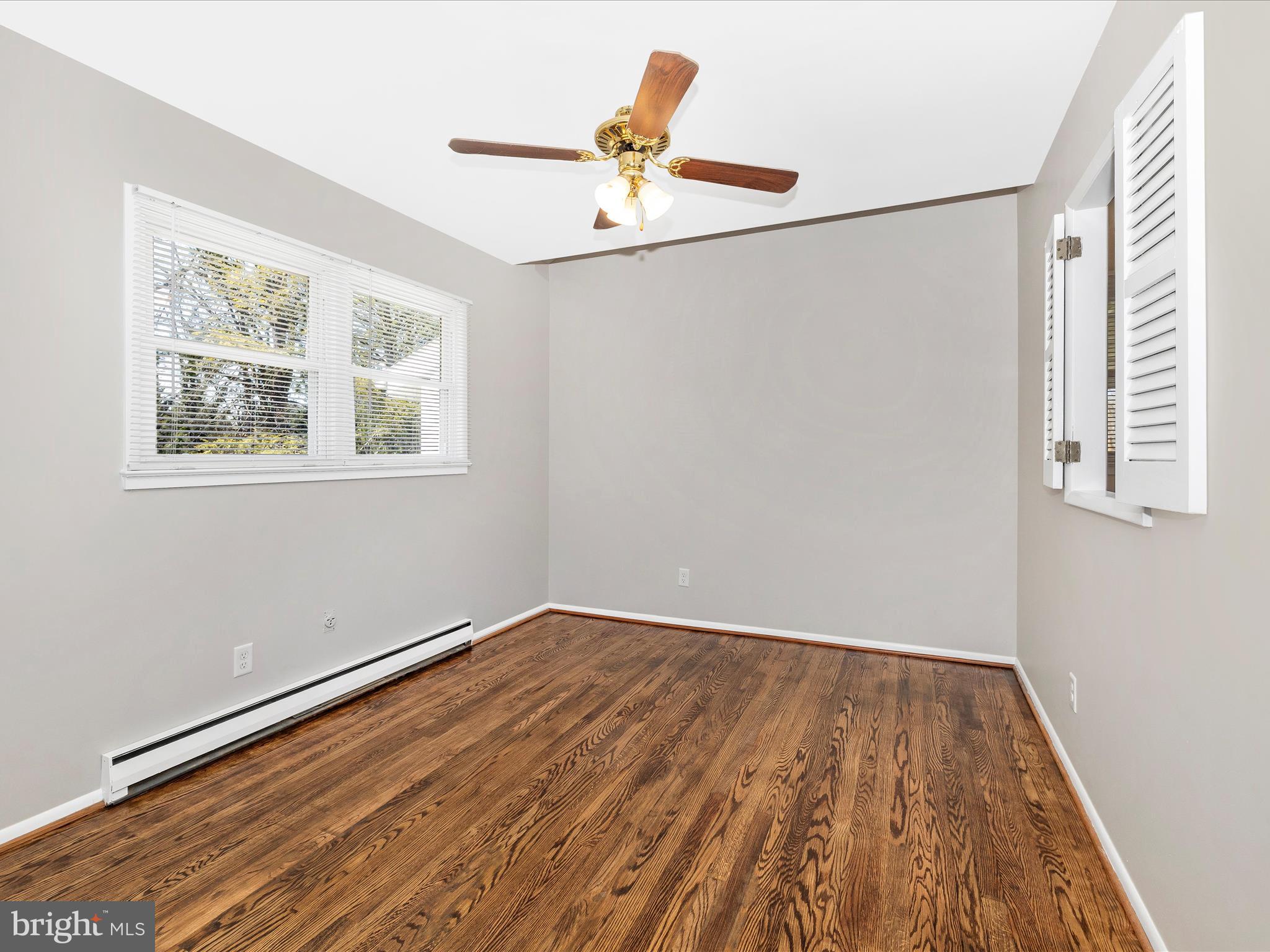 20731 Emerald Drive Hagerstown, MD 21742 - Photo 10 of 54 a view of a room with wooden floor and a ceiling fan
