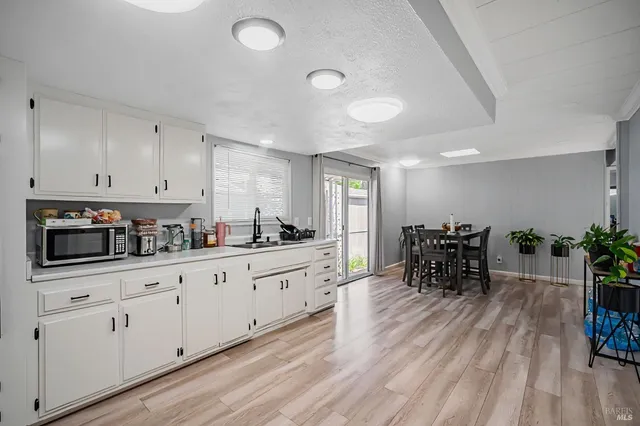 a view of a livingroom with furniture and a window